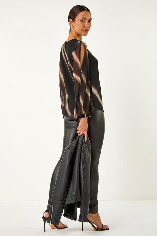 Stripe Print Mesh Overlay Top from Roman. Add a touch of elegance to your Autumn/Winter wardrobe with this chic mesh overlay top featuring an all over stripe print. With long sleeves and an elasticated cuff, this piece is designed with a classic round neck and falls to a flattering hip length. Perfect for layering over a camisole or fitted top, pair with tailored trousers and heels for a sophisticated look that transitions seamlessly from day to night!