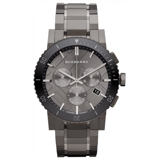 Introducing the Burberry Watch, model BU9381, a harmonious blend of functionality and sleek design. This watch features a robust gunmetal stainless steel bracelet and a complementary dark grey dial. The unidirectional rotating bezel adds a sporty touch, while the chronograph subdials and date display provide practical functionality. Swiss-made precision ensures reliable timekeeping within this sophisticated timepiece. It's an emblem of Burberry's commitment to luxury and performance, crafted for those who demand both style and substance in their accessories. Specification Details Brand Burberry Model BU9381 Barcode Number 822138035095 Gender Unisex Case Diameter 42 mm Case Material Stainless Steel Case Colour Gunmetal Dial Colour Dark Grey Band Material Stainless Steel Band Colour Gunmetal Movement Swiss Quartz Water Resistance 5 ATM Features Chronograph, Date Indicator, Unidirectional Rotating Bezel