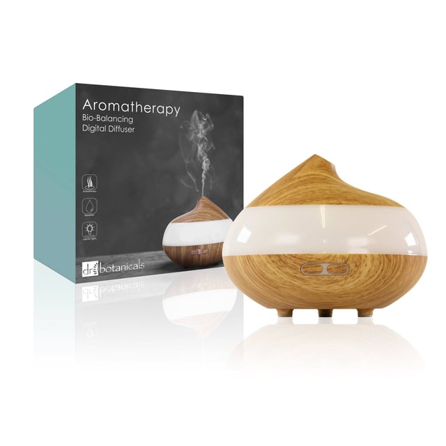 Dr. Botanicals Bio-Balance Wooden Aroma Diffuser is a new technology therapy device that brings together aromatherapy, light-therapy and an air purifier. It features 7 changing light colours to create different moods to the room, 2 mist modes that regulate the scent from deep to light if used with essential oils* and provides fresh humidification for dry indoor air.

Features:
- Lasts 1-3 hours with one fill
- 7 Colour moods of LED light and 2 Mist modes
- Whisper quiet
- Box includes 1 aroma diffuser, 1 adapter and 1 manual

Benefits:
- Relax or uplift your mood with scents from essential oils*
- Balance your ambiance with soft light
- Freshen the air in your home with Anti-dry protection