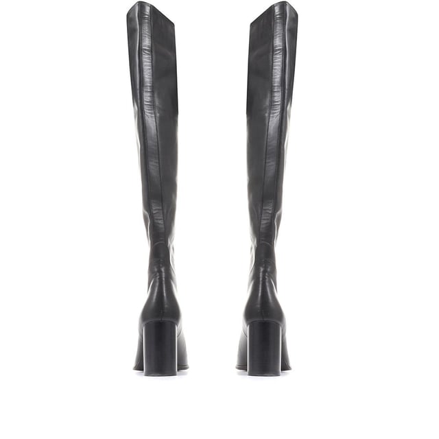Our Lilyana over the knee boots embody elegance and effortless glamour. Crafted from soft, glossy leathers, Lilyana is poised on a stacked heel and imagined with a striking pointed toe. Fully leather lined for a comfortable fit, this pull-on silhouette offers instantaneous wear. Wear with confidence, style Lilyana with skinny jeans or a mini skirt to switch up your regular rotations.