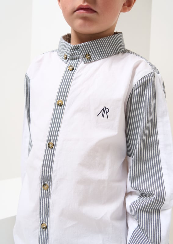 Our   shirt re-mix! Cut and sew colourblock mixing clean   poplin with a classic ticking stripe. Smart dressing! About me: 100% Cotton Angel and Rocket cares: I'm made from Sustainable Cotton Look After Me: Think Planet. Wash At 30C.