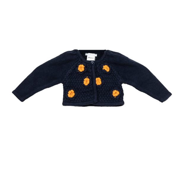 Tricot knit jacket.
 Round neck.
 Button closure on the front.
 Embroidered details on the front.
 Composition: 75% Cotton, 20% Polyamide, 5% Wool
 Care:
- Wash maximum at 30ºC.
 - Iron at medium temperature, max. 110ºC.
 - It is not allowed to use a dryer.
 - Do not use bleach.
 - Does not support dry cleaning.