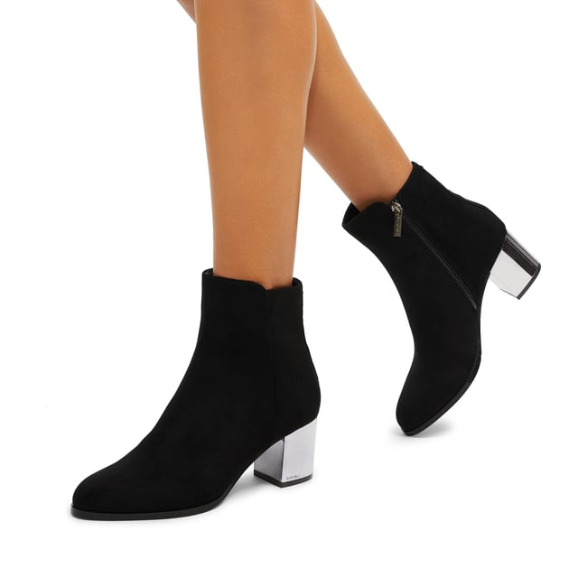This Royale Ankle boot features a black microsuede upper with statement silver block heel.