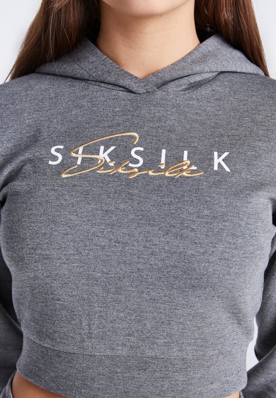 Girls Grey Marl Signature Track Top. White Printed Logo with Gold Embroidered Logo Overlay. 3 Piece Hood. Self Fabric Cuffs and Waistband. Machine Wash. 80% Polyester 15% Rayon 5% Elastane