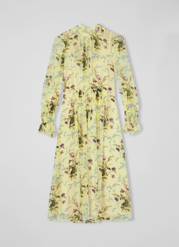 LK Bennett Eloise Dresses, Multi The Eloise dress in the Royal Ascot x LKB collection is crafted from flan yellow silk georgette with a reimagined French 18th century meadow scene in purple, pink and green. It has a slip layer, a round neck with pleat and tie detail, long sleeves with double elasticated cuffs, a gathered waist and a floaty midi skirt.