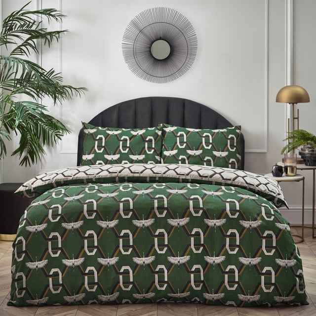 Combining iconic Art-Deco, trending geometric prints, with the timeless beauty of nature, the show-stopping, Avalon duvet cover set is a clever and impressive piece. Gleaming white cranes fly over 3D chain-links, set against a rich, jewel-toned background for a luxurious finish. Turn the duvet cover set over and the cranes have flown off, leaving just the trending Art-Deco style pattern for a modern maximalist look.