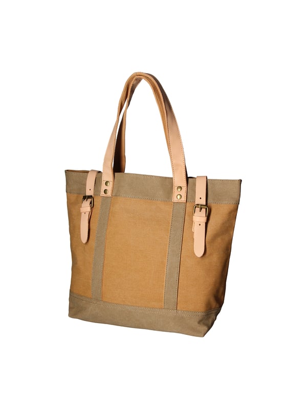 Bolso de mano de mujer de un compartimento en lona y piel genuina. Producto artesanal