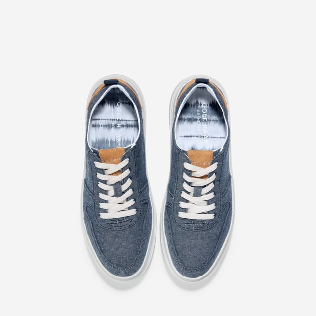 We've given our much-loved, signature GrandPro Rally Court Sneaker an update in organic canvas. Crafted from high-end-yet-durable materials, it features a luxuriously cushioned GRANDFOAM footbed, an EVA outsole, and a classic old-school sneaker vibe
