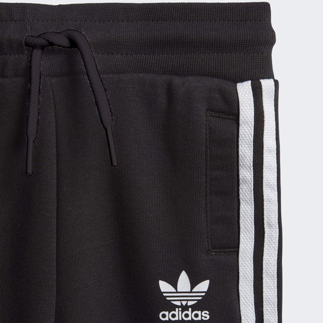 Dress them up in iconic sporty style. A big contrast Trefoil logo and 3-Stripes give this infants' outfit an authentic look. Both pieces are made of a cosy, soft French terry. Hidden shoulder snaps on the sweatshirt make it easy to slip on and off.  - Regular fit is not tight and not loose, the perfect in-between fit - Ribbed crewneck - Long sleeves with ribbed cuffs; Ribbed pants cuffs - 70% cotton, 30% polyester (recycled) - Pants: Side pockets; Drawcord on ribbed waist - adidas partner with the Better Cotton Initiative to improve cotton farming globally; This set is made with recycled polyester to save resources and decrease emissions - Sweatshirt: Snap-button placket on shoulder for easy on and off (up to size 86); Ribbed hem  Shipped by adidas