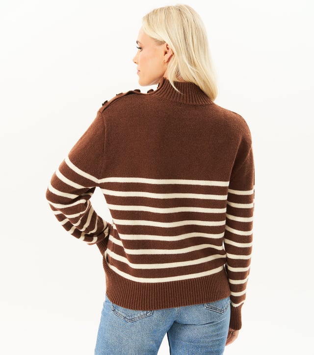 Stay cozy and stylish with ou High Neck Stripe Oversized Jumper. This fashionable sweater features a high neck design and classic stripes, perfect for any fashion-forward individual. The oversized fit adds a touch of trendiness to your wardrobe. Stay warm and look great all season long.MeasurementApprox. length- 75cm