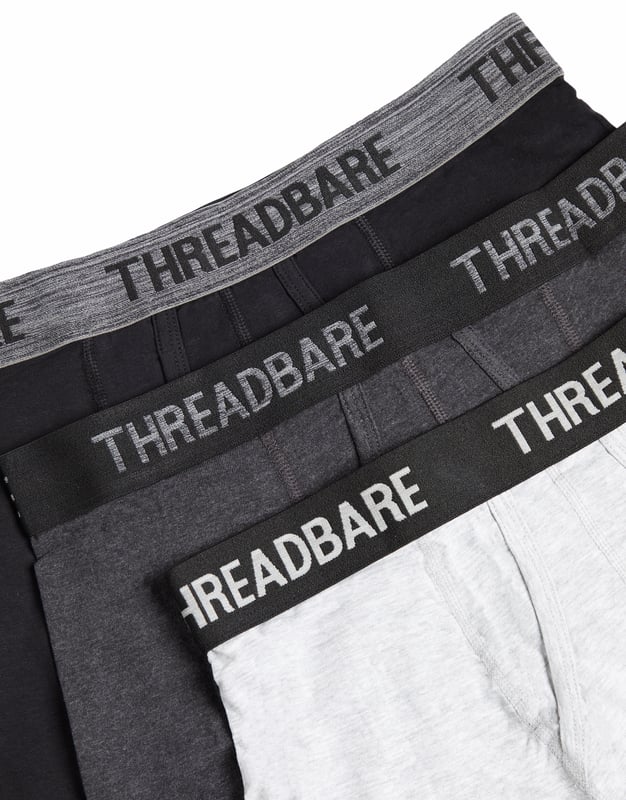 Give your essentials a refresh with this three pack of hipster boxer shorts from Threadbare. In three staple shades, these boxers are made from a soft stretch cotton for exceptional comfort and feature the Threadbare text logo on the centre of the elasticated waistband. Perfect for everyday wear, this pack contains three pairs of boxers; one black pair, one charcoal marl and one grey marl.