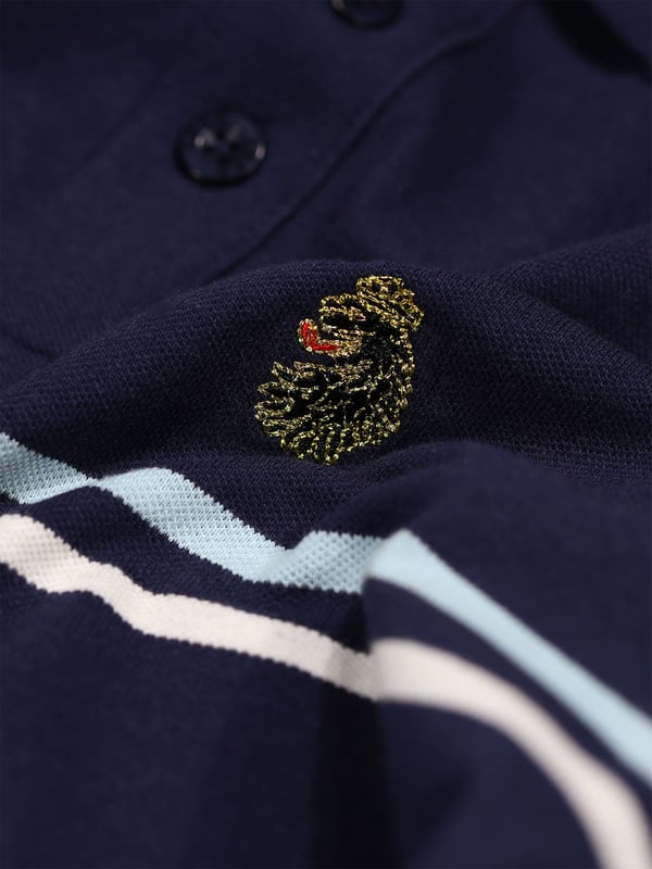 This polo shirt from LUKE is perfect for your everyday line-up. It's crafted from a soft cotton pique and detailed with yarn dyed contrast stripes across the chest. It features a classic button placket which has a contrast colour underside and is complete with the brand's iconic lion head embroidery on the left chest. Iconic LUKE BLACK, GOLD, RED lion head embroidery. Iconic LUKE tri-colour trim tape. LUKE buttons. Contrast yarn dyed chest stripes. Rib collar and cuff. Contrast colour underside of collar.
