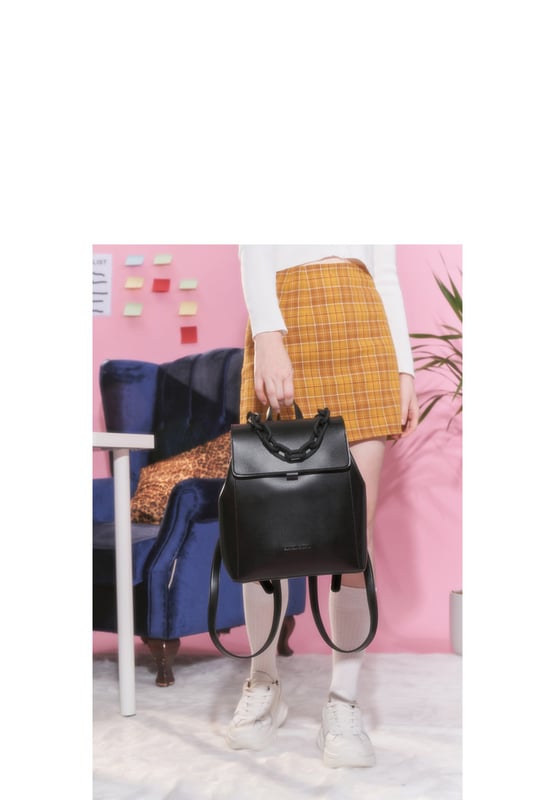 This everyday backpack will become your wardrobe staple, the dreamy soft exterior featuring stitching detail, our debossed logo, and a chunky chain, grab handle is surely a statement piece. This contemporary bag is not only stylish and roomy but puts comfort first with adjustable straps, all done at the ease of a buckle. Features: , Claudia Canova blind debossed logo, Flapover front with two mag-dot fastenings, 2x grab handles, Two adjustable backpack straps, Gunmetal hardware, Side clip feature to widen the bag if needed Style Ref: 84304 BLACK