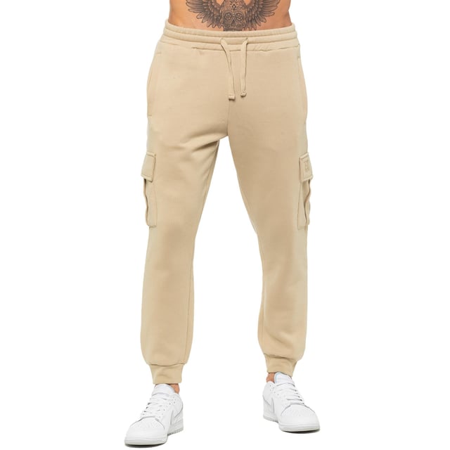Enzo Mens Regular Fit Cargo Joggers. Features 2 Side Slash Pockets, 2 Cargo Pockets, Single Welt Back Pocket. Brushed Back Inner Fleece. Elasticated Waistband With Adjustable Drawstring. Cuffed Ankle. Features EZ Logo.