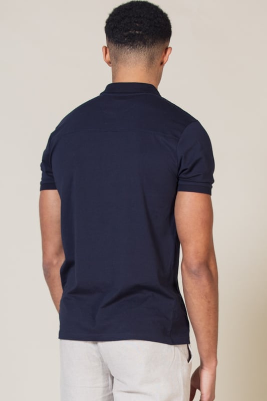 Stay stylish with this polo shirt by Nines Collection. This shirt is a classic design and features a zip fastening at the neck, knit detail collar and Nines branding on the chest. Made from 100% cotton pique fabric to ensure comfortable wear and easy care.