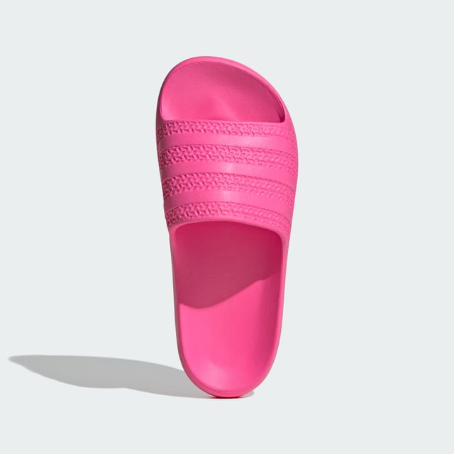 The moment you step into these adidas Adilette Ayoon Slides, you're at ease. That's the whole point of them. They let you bring the comfort of home with you anywhere, thanks to the super soft one-piece EVA foam build. That minimalist approach extends beyond the construction — the colours also keep things toned down, which happens to mean that they also style well with everything.  - Slip-on - EVA upper - Ultra-soft feel - EVA outsole  Shipped by adidas