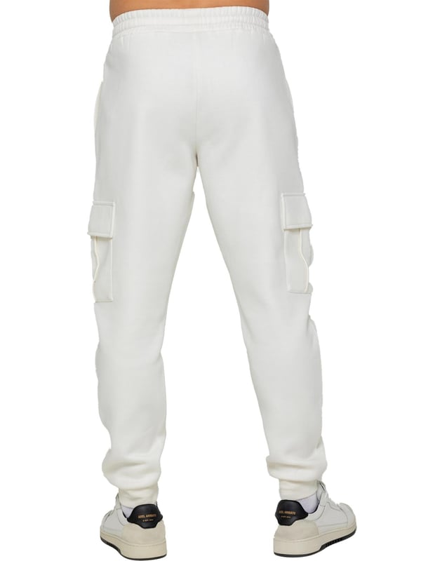 Experience superior comfort and style with Enzo Men's Regular Fit Cargo Joggers! Crafted with a brushed back inner fleece lining, these joggers are designed to keep you cozy all day long. Perfect for casual wear, they feature convenient 2 side slash pockets and 2 cargo pockets, providing ample storage space for your essentials. Stay on-trend with the cuffed leg design, offering a modern silhouette and added comfort.