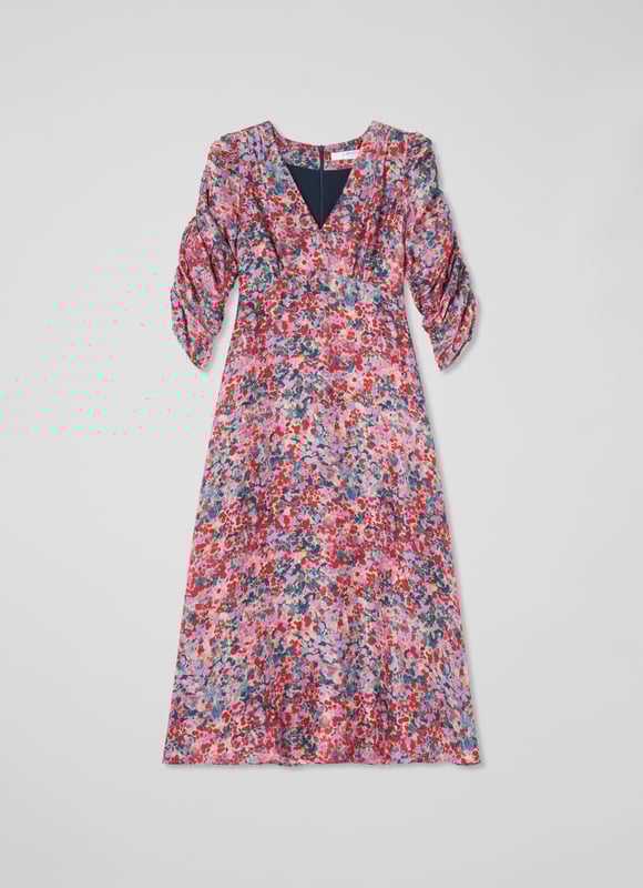 Experience an enchanting garden with the Erin petite watercolour floral jacquard dress. In a delicate pink silk, it features a V neck, full length sleeves, and an exquisite jacquard base with a back zip for a flawless fit. Perfect for evening occasions, it pairs beautifully with subtle gold accessories and elegant heels.