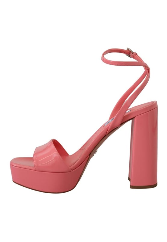 Brand: PRADA
  Condition: Brand new with tags
  Model: Block heels platform sandals
  Color: Pink
  Material: 100% patent leather
  Leather bottom sole for durability
  Logo details showcasing the iconic PRADA brand
  Made in Italy with high craftsmanship
  Exclusive and luxurious design
  Perfect for fashion-forward women
Material: 100% patent leather