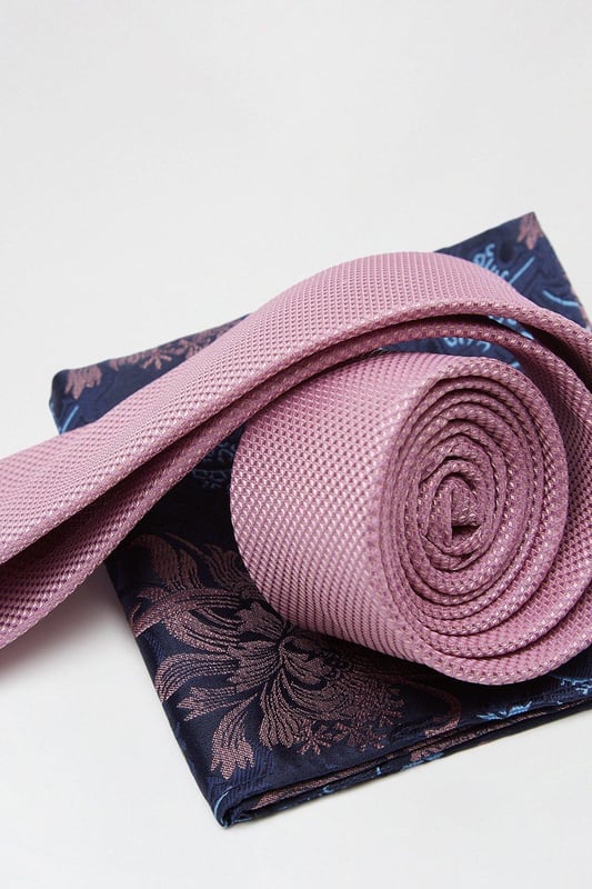 Complete the look with our collection of suit accessories. From classic bow ties, to lapel pins to braces and cuff links we've got everything you need to take suiting to the next level. Style: Pink Tie And Floral Pocket Set.  Ideal for: Occasion.  Design: Plain.  Model wears size UK 10 and is 5' 9" tall.