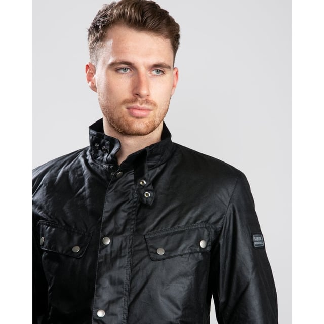 A mainstay of the World Tour collection, the Duke is a re-work of the iconic Enfield jacket in a winter-ready waxed cotton.
With biker styling and a robust construction, the Duke is crafted in Barbour&rsquo;s 6oz Thornproof wax for durable protection with a lustrous finish, complete with a two-way zip and hardy studded storm fly front. A quilted nylon lining adds warmth, while the cosy funnel collar and stud-fastening cuffs boast a contrast corduroy lining for incredible softness and a signature Barbour look.
Paying homage to Barbour&rsquo;s motorcycle heritage, authentic detailing includes elbow patches, four studded pockets and a collar strap. The lower bellow pockets feature a stylish pleat and are generously proportioned to carry essentials without adding bulk, while a zipped inner pocket safeguards valuables. Available in four versatile colours with the Barbour International badge to the sleeve, the Duke is subtly tailored with a relaxed fit ideal for winter layering.

Back length: 28.5–32" | 71.5–81.5cm
Mediumweight 6oz Thornproof wax outer
Sponge clean only