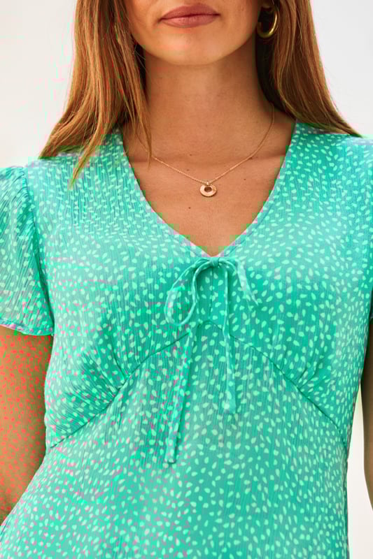 REASONS TO BUY:

Your jeans will love it
Fabulously feminine details
Bust-flattering V-neck and empire line cut
Delicate angel sleeves
Figure-skimming peplum hem
Just add jeans or denim shorts.