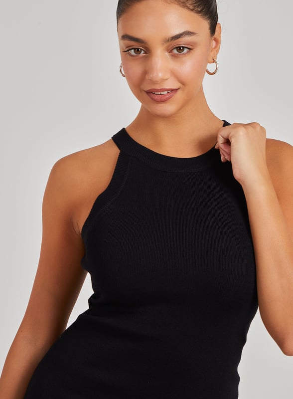 Don't miss out on the party wear piece of the season! This Racer Back Ribbed Mini Dress will keep all eyes on you. Pair with strappy heels for a trend-worthy look.
