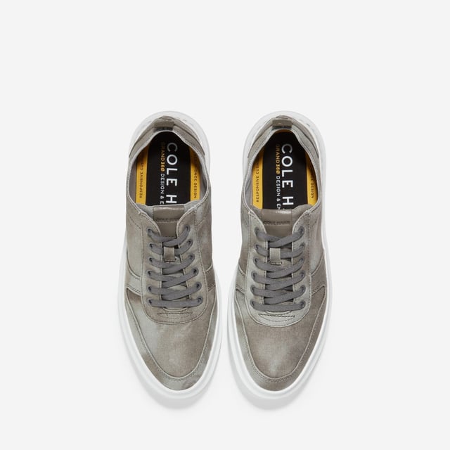 We've given our much-loved, signature GrandPro Rally Court Sneaker an update in organic canvas. Crafted from high-end-yet-durable materials, it features a luxuriously cushioned GRANDFOAM footbed, an EVA outsole, and a classic old-school sneaker vibe