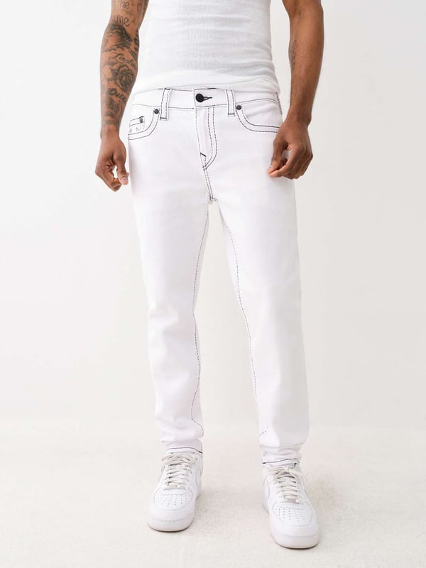 Change out those classic blues and opt for something brighter. The Rocco Big T Skinny Jean is white, bright, and perfect for summer featuring a zip fly, belt loops, and contrasting Big T stitching. Finished with five pocket construction, horseshoe detailing on the back, and a shorter 32" inseam. 