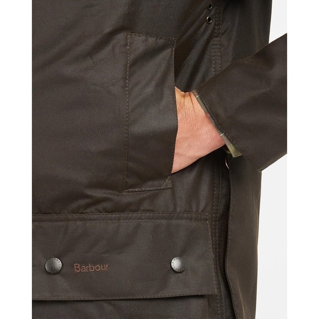 The Classic Beaufort is a stylish, practical men's waxed jacket with timeless country looks and a Sylkoil outer.
Quintessentially Barbour, this versatile jacket is tough enough to brave the great outdoors yet equally suited to city wear - it offers a relaxed fit perfect for throwing over a suit when commuting to work. Ideal for year-round use, it boasts a 100% cotton lining in Barbour's iconic tartan print, with an interactive zip designed for pairing with an optional quilted liner when extra insulation is needed.
The Classic Beaufort's smart corduroy collar feels luxuriously soft and is studded to take an optional hood, while the two-way zip, studded storm fly front and Velcro-fastening wind cuffs seal out draughts. Two lower bellow pockets offer plenty of room for essentials, and moleskin-lined handwarmer pockets provide welcome warmth on cold days. A useful rear game pocket completes the impressive line-up of functional features.

Mediumweight Barbour Sylkoil
Pure cotton Barbour Tartan lining
Corduroy collar
Two way zip
Two large bellow pockets
Two handwarmer pockets
Full width, lined, rear game pocket with side zips
Velcro fastening wind cuffs
Extra zip pocket underneath the storm flap
Studded storm fly
Length: 33-34ins | 84-86.5cm
Studded for optional hood
Interactive zip