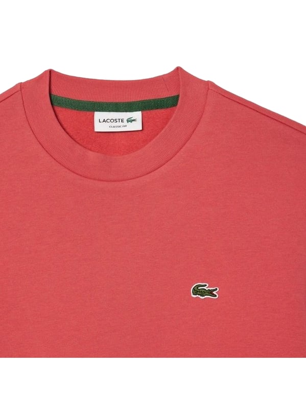 Timeless style renewed every season in a new color palette  in our signature details and a sustainable approach. Classic fit  natural ease on body with comfortable sleeves. Solid crewneck sweatshirt in brushed fleece made of organic cotton and recyled polyester. Piqué necktape in iconic Lacoste green. Embroidered 3cm green crocodile sewn on chest.