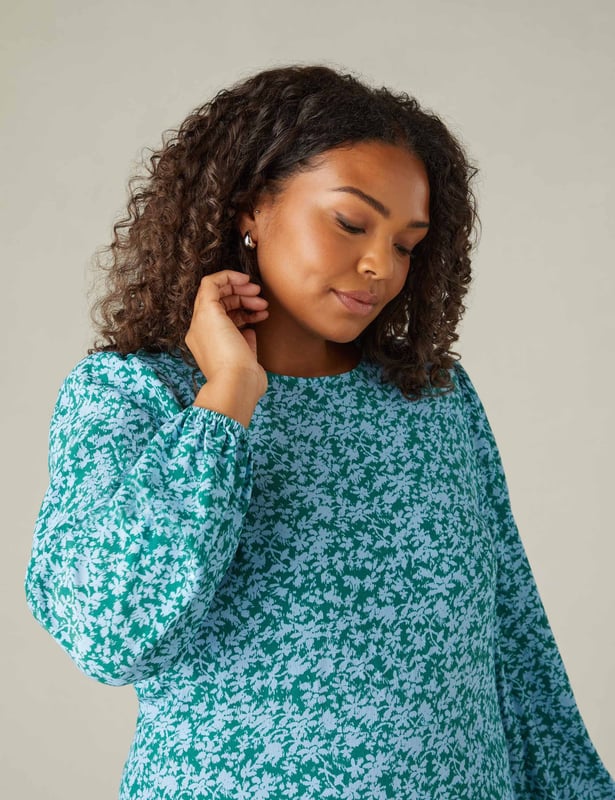 Printed all over with a beautiful ditsy print, this Midaxi dress is cut from a soft woven fabric that moves beautifully. It has a round neckline with a keyhole button at the back neck, as well as short blouson sleeves with elasticated cuffs. Its swingy midaxi shape is enhanced by a single tier at the hem, which gives it a relaxed, pretty silhouette.