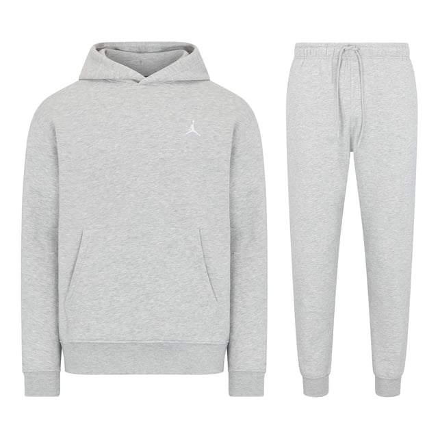 Stay cosy and stylish with this Jordan Fleece Tracksuit Set, combining a classic hoodie and joggers for all-day comfort. Crafted from soft brushed-back fleece, this set is smooth on the outside and plush on the inside, providing warmth and a premium feel. Perfect for casual wear or lounging, this tracksuit delivers timeless style with its simple design and iconic Jumpman logo. The hoodie features an adjustable hood and a spacious front pocket for convenience, while the joggers include an elastic waistband with a drawcord for a personalised fit and side pockets for small-item storage. The embroidered Jumpman logo adds a signature finish to both pieces, making this set a standout addition to your wardrobe. 
Key Features:
Material: 80% cotton/20% polyester fleece for warmth and comfort. 
Hoodie Design: Brushed-back fleece with a front pocket for practicality and embroidered Jumpman logo. 
Jogger Design: Elastic waistband with adjustable drawcord, side pockets, and embroidered Jumpman logo. 
Comfort: Soft fleece fabric with a smooth exterior and plush interior for all-day wear. 
Care Instructions: Machine washable for easy maintenance. 
Colour: Carbon Heather/White 
Style Code (Hoodie): FJ7774-091 
Style Code (Joggers): FJ7779-091 
This tracksuit combines iconic Jordan style with everyday functionality, making it perfect for any occasion.