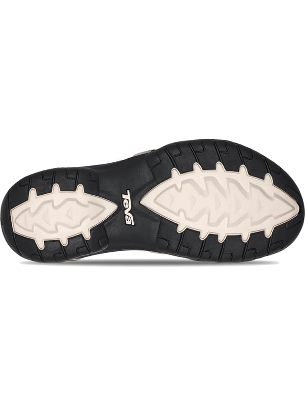 Teva sandalen Beleef het avontuur in stijl en comfort in deze trekking sandalen voor dames. De verstelbare klittenbandsluitingen zorgen voor een pasvorm op maat en een stevige grip. Met een dempende EVA-tussenzool en geïntegreerde Shoc Pad bieden deze sandalen optimaal comfort bij elke stap. Het voorgevormde voetbed past zich aan je voet aan en biedt extra ondersteuning op ruw terrein. Een robuuste buitenzool zorgt voor stabiliteit en duurzaamheid. De subtiele labelbelettering rondt het ontwerp stijlvol af. Perfect voor buitenavonturen, wandelingen of dagelijks gebruik. Deze sandalen bieden de ideale combinatie van functionaliteit en modieus design.