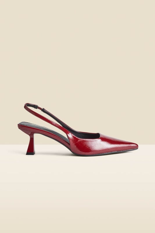 Accessories on point Crafted from luxe crinkle leather in a stunning cherry red patent finishChic slingback with an elasticated insert for a comfortable fit Sexy pointed toe silhouetteSet on a super-wearable flared kitten heel We love them with jeans and a blazer