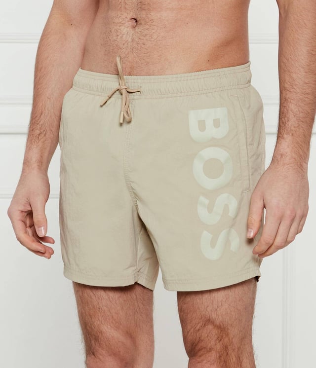 STYLE OCTOPUS – 50515296
Statement swim shorts with full lining by BOSS, designed in soft quick-drying poplin featuring a vertical logo print on the left leg. For our BETTER BOSS products, we always use at least 60% better raw materials. This product is made from at least 60% recycled polyamide. By using recycled polyamide, we aim to save resources by making use of existing plastic material. Recycled nylon is usually made from pre-consumer spinning or fabric waste and may also come from post-consumer industrial fishing nets. We only use raw materials with a verified chain of custody to ensure the use of certified recycled polyamide.
100% Polyamide (recycled), Lining: 100% Polyester
30°C fine wash
Do Not Bleach
Do Not Tumble Dry
Do Not Iron
Do not chemical dry clean
The model wears a size M and is 189 cm tall with a, 98 cm chest, 80 cm waist and 94 cm hips.