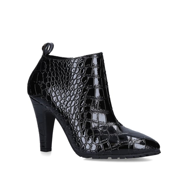 The Shoreditch Bootie is crafted from croc embossed shiny cow leather for structure and durability. The ankle tab is topped with mini antiqued brass Eagle head with all over feather texture and opaque brass crystals. Heel height: 10cm. Concealed inner side zip with leather pull tab. Material: Embossed cow leather.