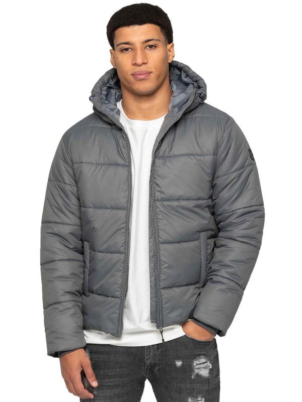 Introducing the Men's Hooded Puffer Jacket—a perfect blend of warmth and style. Featuring a high-neck design and long sleeves. The front zip-up closure offers a sleek and modern look, while the two spacious zipped side pockets provide practicality for carrying essentials. Ribbed cuffs and drawcord hem with adjustable toggle to add to the secure fit, enhancing overall comfort. Crafted from durable materials, this puffer jacket is both functional and stylish, ideal for everyday wear
•	Hooded Puffer Jacket
•	High-neck design
•	Ribbed cuffs
•	Drawcord hem with adjustable toggle