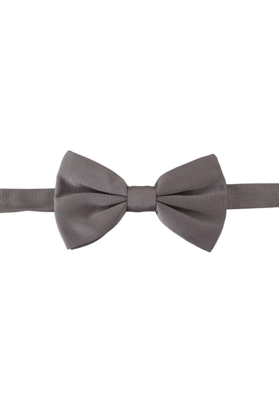Stunning Dolce & Gabbana gray silk bow tie
  Made with 100% silk
  Timeless gray color
  Adjustable length neck strap
  One size fits all
  Expertly crafted in Italy
  Width: 7cm
  Versatile accessory for formal and special occasions
Material: 100% Silk