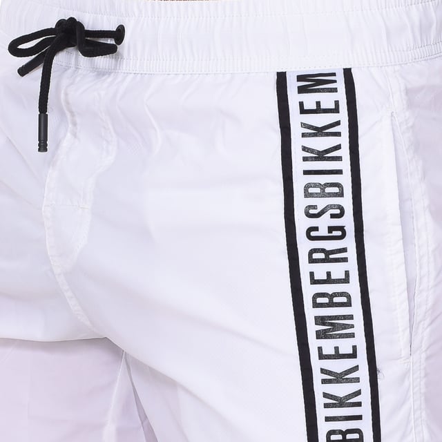 Bikkembergs men's swim shorts.
 Color White-black
 Elastic waistband, adjustable by cords.
 Open pockets on the sides.
 Brand print on the side of the front.
 Back pocket with velcro closure.
 Inner mesh lining.
 Seams seen in tone.

 Composition: 100% Polyester

 Washing instructions:
 - Wash at max temperature. 30th.
 - Do not use bleach.
 - Does not allow dry cleaning.
 - Iron temperature max. 110º.
 - Do not use dryer.
 Composition: 100% polyester
 Care:
Washing instructions:
 - Wash at max temperature. 30º.
 - Do not use bleach.
 - Does not allow dry cleaning.
 - Iron max. temperature. 110º.
 - Do not use dryer.