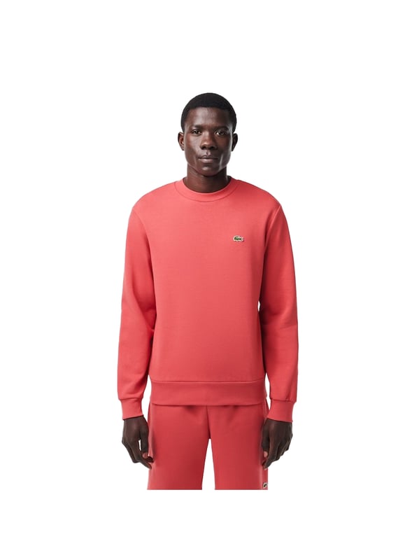 Timeless style renewed every season in a new color palette  in our signature details and a sustainable approach. Classic fit  natural ease on body with comfortable sleeves. Solid crewneck sweatshirt in brushed fleece made of organic cotton and recyled polyester. Piqué necktape in iconic Lacoste green. Embroidered 3cm green crocodile sewn on chest.
