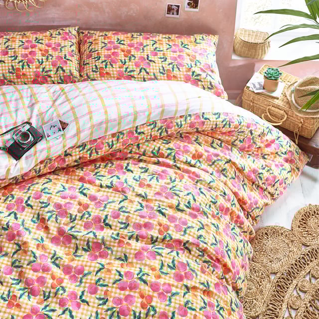 Make a statement with the Juicy duvet set. Featuring juicy peaches on a gingham base. The colour continues to the reverse with pink and yellow gingham design so you can switch the look when you need to.