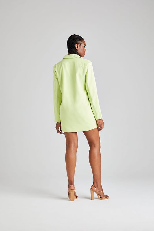Model is 5'6 and wears a size 8. Oversized fit. Long sleeves. Pockets. Button fastening. Mini length. The perfect style oversized blazer featuring a flawless oversized silhouette with button fastening and long sleeve detail. The ideal dress for a day out with friends to a holiday centrepiece, this dress will quickly become your favourite.