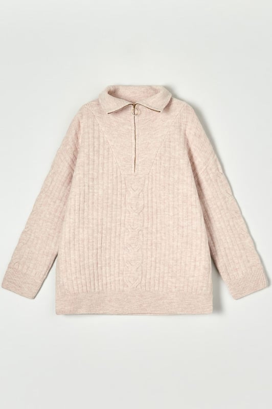 Gorgeous winter jumper in two luxurious soft colours. Great for casual looks, or paired with knee high boots for a contemporary stylish look. Super soft cable knit, in an oversize relaxed fit. Model wears a UK XS (is usually a size 8-10). Size down for a more fitted look.

Super soft chunky cable knit
72% Acrylic 25% Polyester 3% Elastane
Zip Neck with collar
26" Shoulder to Hem
Long Sleeve
Sizing: Run large for size
Fit: Oversized Boyfriend Fit