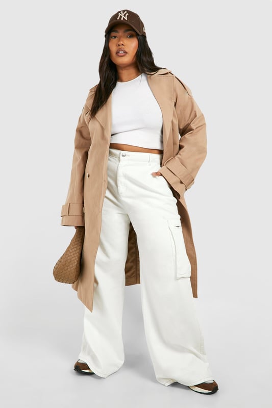 Wide-leg silhouette for a relaxed, on-trend look
        Cargo-style pockets add functional flair
        High-waisted design for a flattering fit
        Denim fabric offers durability and comfort
        Plus-size fit ensures inclusive styling
    
    Make a bold statement with these ecru cargo jeans, perfect for the fashion-forward woman who values both style and comfort. The wide-leg cut creates a relaxed silhouette that's right on trend, while the high-waisted design accentuates your curves in all the right places. Cargo pockets add a utilitarian edge, making these jeans as practical as they are stylish. Pair them with a cropped top and oversized coat for a chic, layered look that's ideal for casual outings or family gatherings. For a more laid-back vibe, team with a simple tee and trainers. The versatile denim fabric ensures these jeans will become a go-to piece in your wardrobe, easily transitioning from day to night with a simple change of accessories. Embrace the cargo trend and showcase your unique style with these must-have jeans from Boohoo.