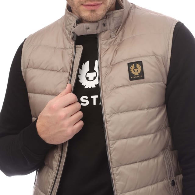 Mens Belstaff Down Filled Nylon Circuit Gilet in grey.- Adjustable throat latch with knurled buckle.- Exposed centre zip closure.- Multi-stitched side pockets with snap-button closure.- Channel quilted gilet.- High-density  water-repellent nylon fabric.- Lightweight and compressible.- 100% Polyamide.- Ref: 105297CRGRY