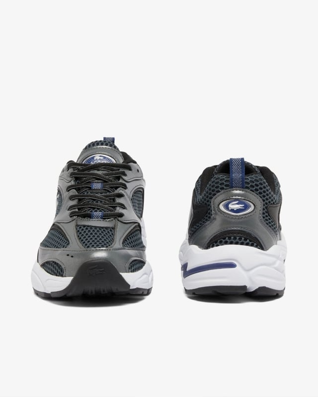 Lacoste Mens Storm 96 2K Trainers The Storm 96 2K is a creative re-imagining of the Velocity 96, Lacoste’s very first running shoe, blending 2000s running designs with modern, lifestyle-centered features. With dynamic lines and bold choices of materials, including metallic elements to create a striking style.
Mesh and synthetic leather upper
TPU plate and inserts in midsole for improved support
EVA midsole for comfort and cushioning
Textured, robust, high-grip rubber outsole
Signature crocodile on center panel, heel and tongue
Upper: 59% Polyester 41% Polyurethane; Lining: 100% Recycled Polyester; Insole: 100% Polyester; Outsole: 48% EVA 43% Rubber 9% Thermoplastic Polyurethane
48SMA0071