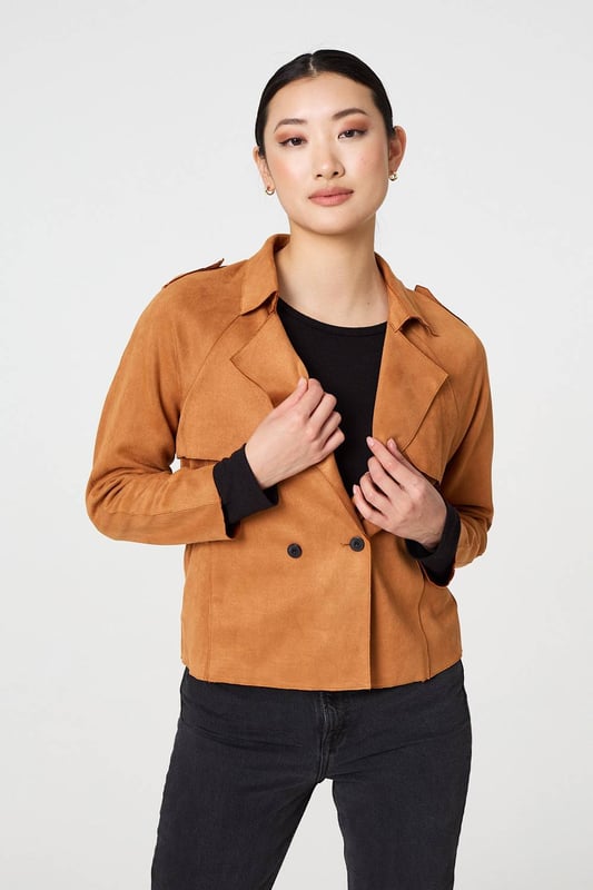 Add an extra layer lo your look with this cropped jacket. It's made from a soft suede feel fabric; and you can wear it over any outfit, including formal dresses or eveningwear. It has a lapel collar and button details, with long sleeves and a fitted shape. Pair this cropped jacket with smart trousers and you can wear it to work too.