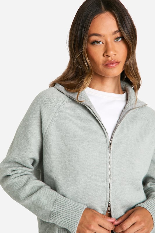 Tall-fit cardigan for extended length and coverage
        Funnel collar design for added warmth and style
        Full-length zip closure for versatile wear
        Ribbed cuffs and hem for a snug fit
        Relaxed silhouette perfect for layering
    
    This tall cardigan with funnel collar and zip is a must-have addition to your casual wardrobe. Its versatile design allows for effortless styling, whether you're heading to a family gathering or a laid-back outing with friends. Layer it over a simple white tee and pair with wide-leg trousers for a chic, comfortable look. The full-length zip offers flexibility, allowing you to adjust your level of warmth throughout the day. For a cosy night in, team it with your favourite leggings and slip-on trainers. The funnel collar adds a touch of sophistication, making it suitable for slightly dressier casual occasions. This cardigan is perfect for those in-between seasons when you need an extra layer without the bulk of a heavy coat. Its relaxed fit ensures comfort without compromising on style, making it a versatile piece you'll reach for time and time again.