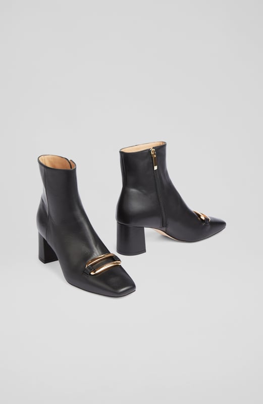 LK Bennett Novella Ankle Boots,Black A chic leather ankle boot with a bit of detail, our new Novella boots can elevate the everyday when you need them too. Crafted in Spain from beautiful black smooth calf leather, they have an almond-shaped toe, a gold bar embellishment with LKB logo detail, an inside zip and a leather-wrapped 60mm block heel. Wear them with tailoring, dresses or jeans - Novella can do it all.